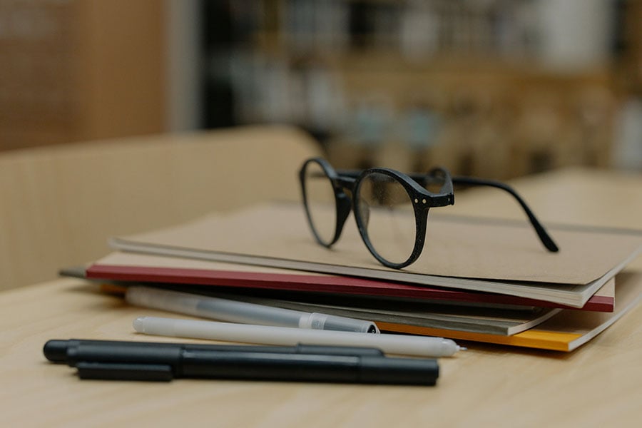 books and glasses on table